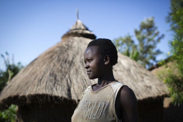 Aziza Musa, 27, attends her farm near the village of Indori in Western Kenya on April 29, 2015. Aziza is a Fistula survivor. Through the help from the Women and Development Against Distress in Africa (WADADIA), founded by Habiba, she managed to cure herself and she now lives a stable and productive life.