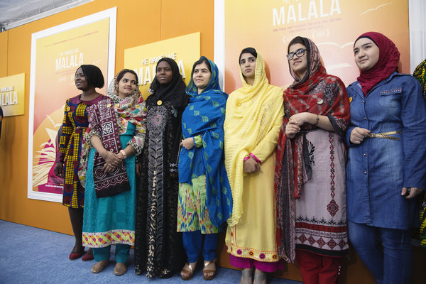 Amina is standing to the right of Malala. Salam is on the right end. Photo credit: Malin Fezehai/HUMAN for Malala Fund