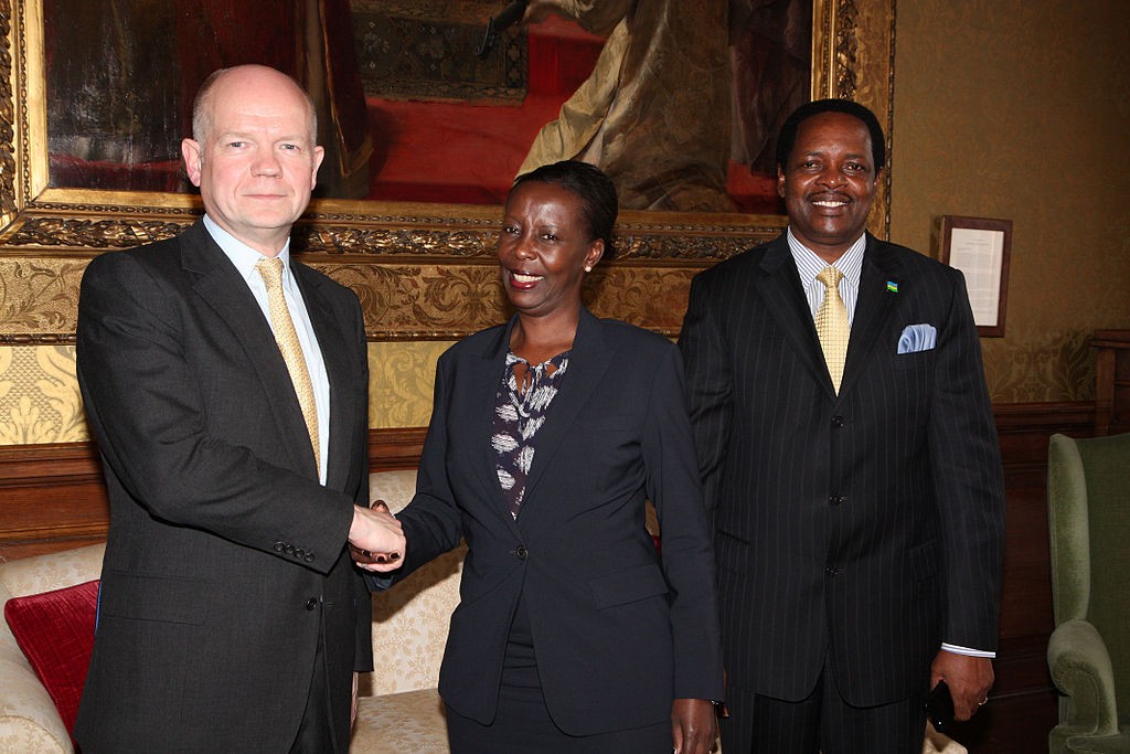Rwandan Minister of Foreign Affairs Louise Mushikiwabo, center, meets with then-Secretary of State for Foreign Affairs William Hague in 2013. (Photo credit: Foreign and Commonwealth Office/Flickr)