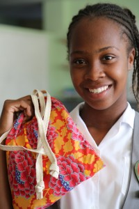 A Jamaican student with her Days for Girls Kit. (Photo credit: Days for Girls)