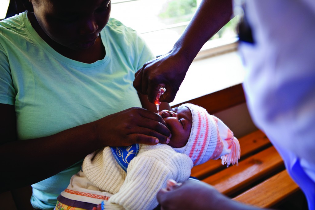 A baby in Kenya receives the polio vaccine.